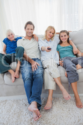 Portrait of a family watching television