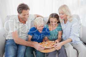 Family eating pizza together