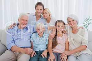 Extended family smiling at camera