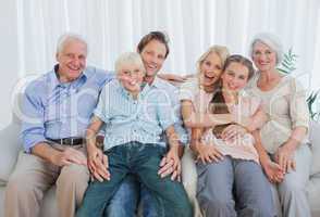 Portrait of an extended family sitting on couch