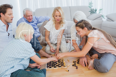 Extended family playing chess