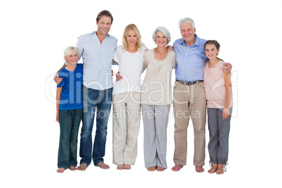 Family standing against a white background