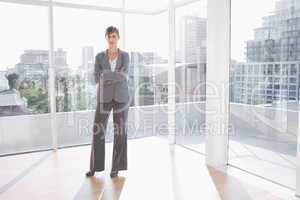 Businesswoman standing in bright office