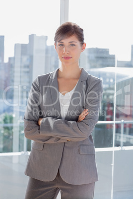 Pretty businesswoman beside large window