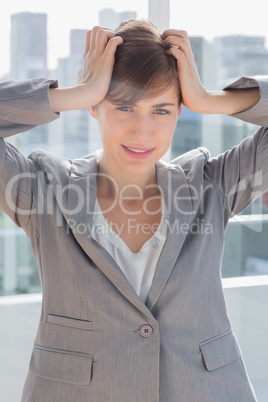 Stressed out businesswoman looking at camera