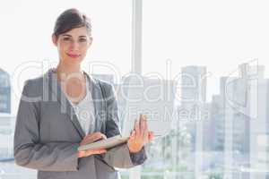 Businesswoman holding laptop