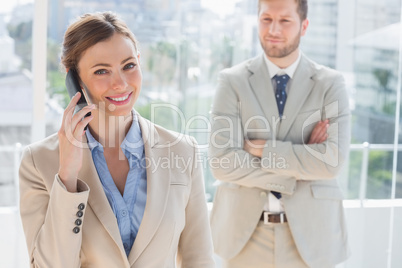 Happy businesswoman having phone conversation