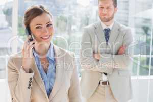 Happy businesswoman having phone conversation