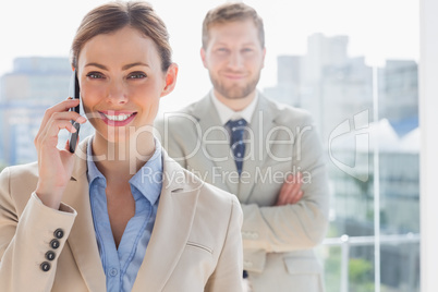 Smiling businesswoman having phone conversation