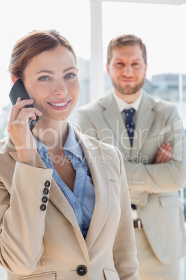 Pretty businesswoman having phone conversation