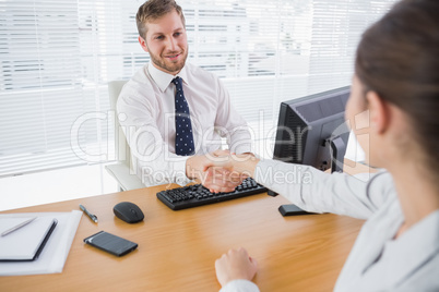 Businessman shaking hands with a colleague