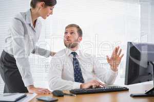 Business people meeting at businessmans desk