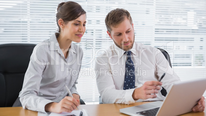 Business people working together with laptop