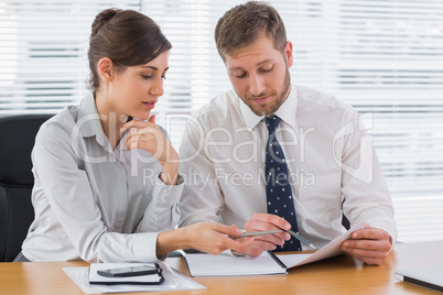 Business people going over documents