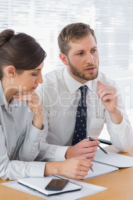 Business people discussing documents