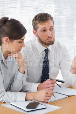 Business people chatting over documents