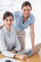 Businesswomen smiling at camera