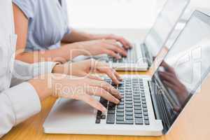 Businesswomens hands typing