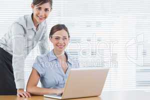 Businesswomen smiling at the camera