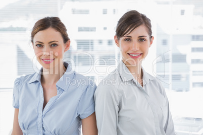 Businesswomen smiling at camera