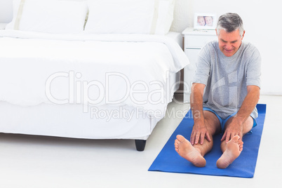 Man working out on an mat