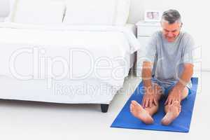 Man working out on an mat