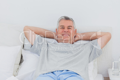 Man relaxing in bed