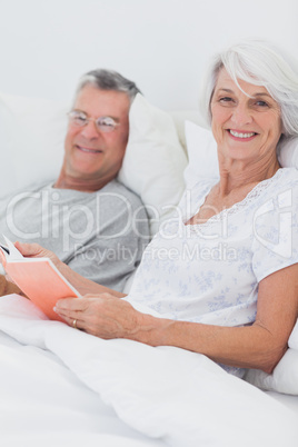 Couple reading together in bed