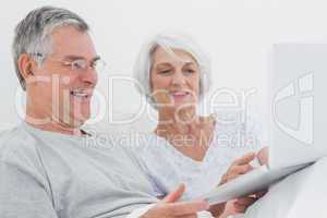 Mature couple using a laptop together
