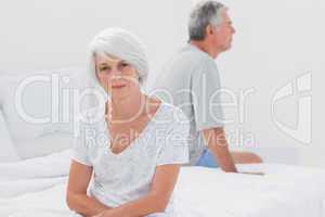 Woman sulking in bed during a conflict