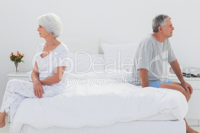 Mature woman sulking in bed during a conflict