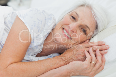 Woman relaxing in bed