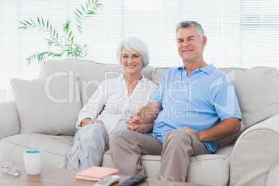 Mature couple sitting on a couch