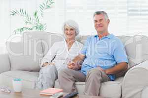 Mature couple sitting on a couch