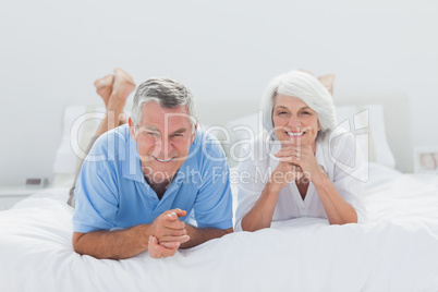 Couple lying together in bed