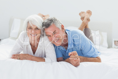 Beautiful couple lying on bed