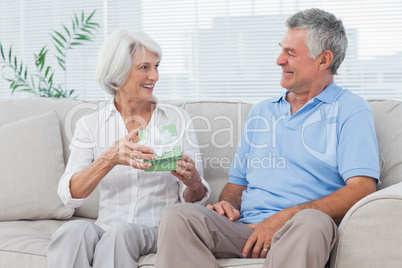 Man giving a present to wife Man giving a present to wife