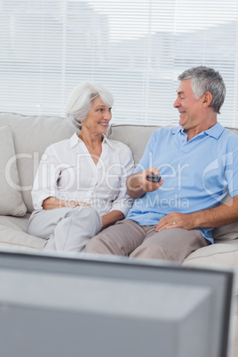 Couple watching tv on the couch
