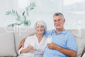 Couple drinking glasses of milk