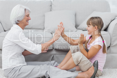 Young girl and grandmother playing together