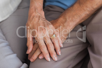 Close up of couple holding hands