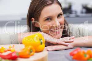 Woman leaning on the counter  of her kitchen