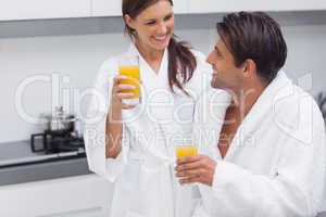 Couple drinking orange juice