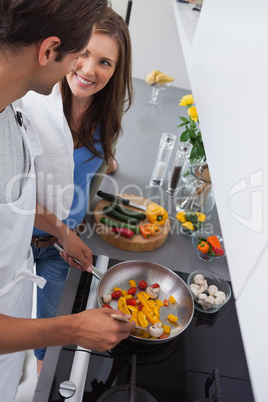 Man cooking vegetables