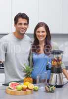 Couple cutting fruits