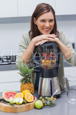 Woman leaning on her blender
