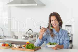 Woman eating a vegetarian salad