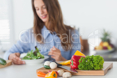 Pretty woman eating a vegetarian salad