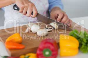 Woman slicing mushrooms