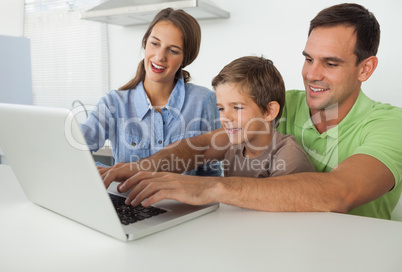 Father and son using a laptop